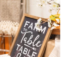 A chalkboard with Farm to Table written on it.
