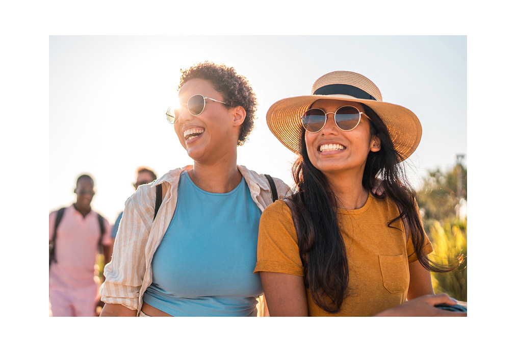 Two women smiling in the sunshine