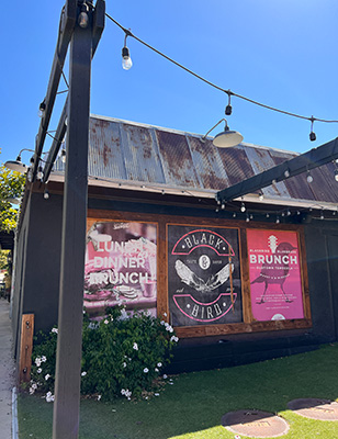 Signs on the side of a barn