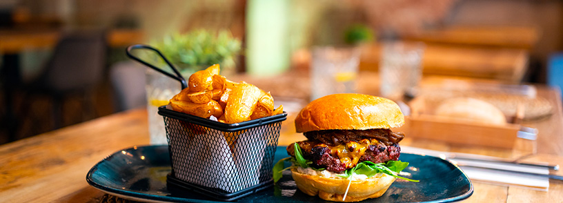 A gourmet burger and fries at a restaurant